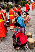 Luang Prabang, Laos - At dawn, monks receive their alms, the 'Tak bat'. 